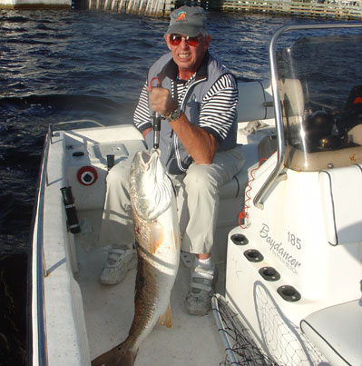 Sarde Howell, pioneer of handicapped fishing tackle, shows this trophy red drum pulled from bridge pilings. At the right times, bridges provide excellent structure for a variety of fish.